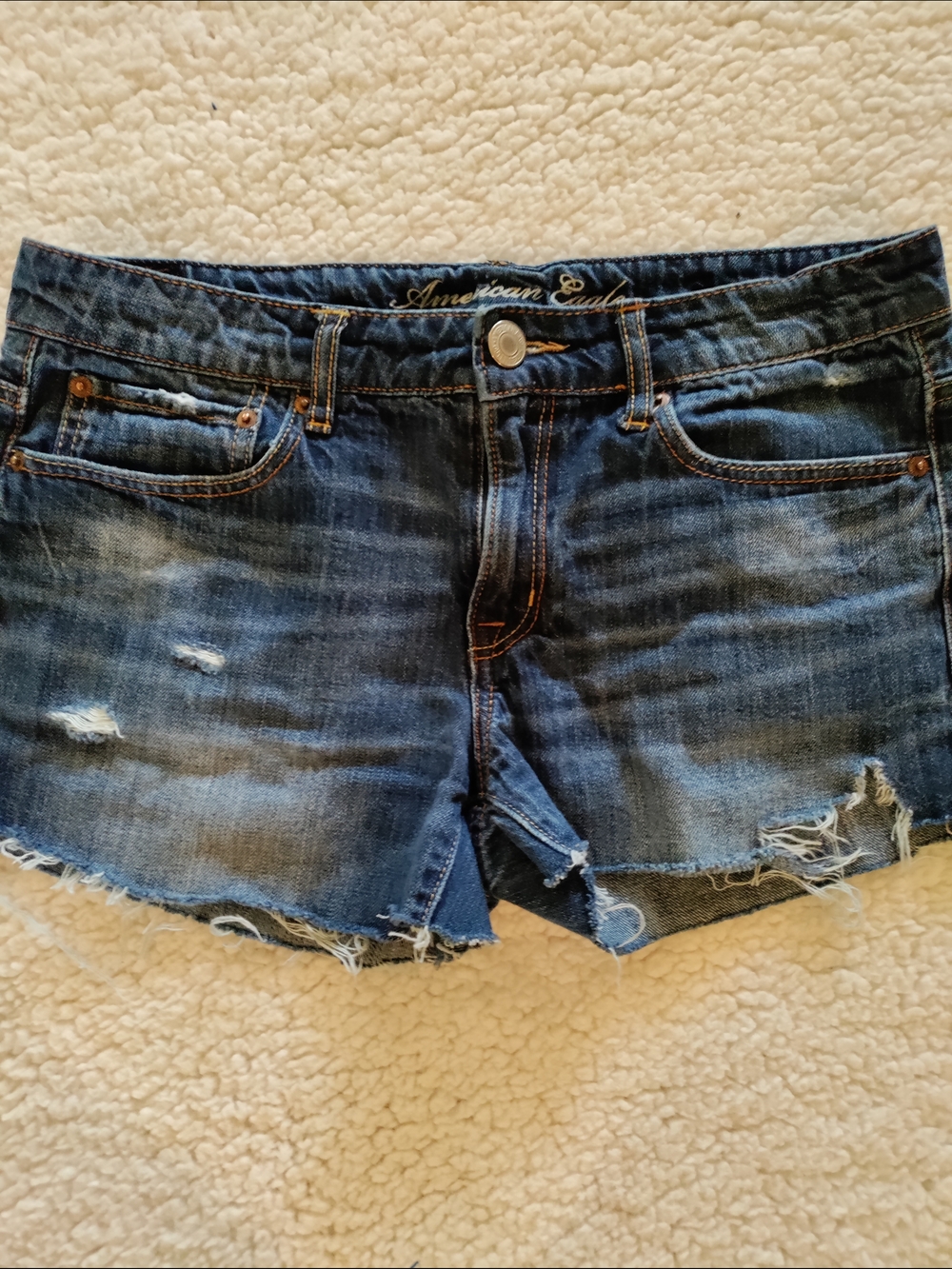 American Eagle Outfitters distressed medium blue denim cutoff shorts